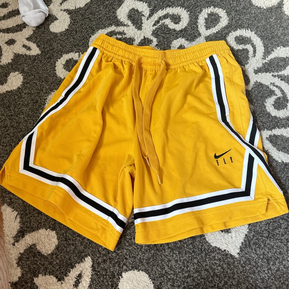 Nike Women’s yellow and black shorts #yellowshorts